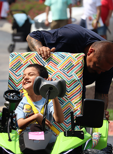 A young driver gets ready to drive his new Geeks for Kids car