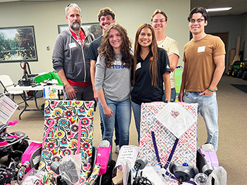 Pitt State Team in front of Geeks for Kids cars