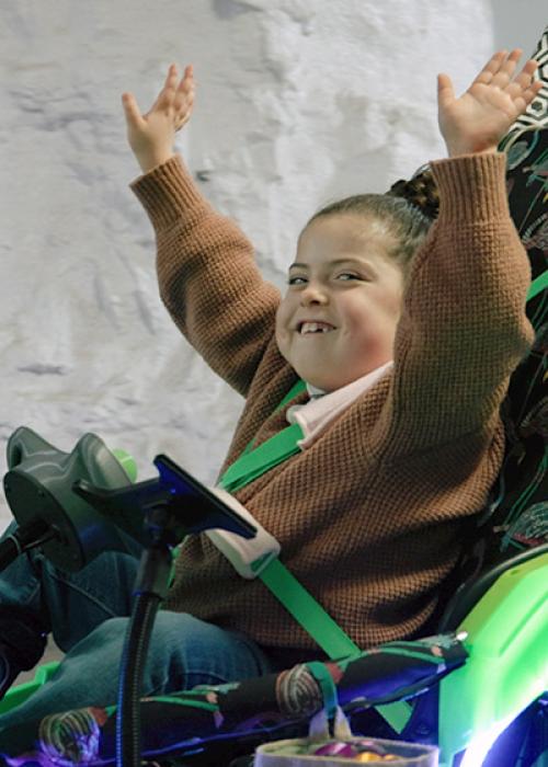 Brooklyn Brakes smiling, arms streched high