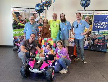 Juniper in her car on delivery day with her family and volunteers
