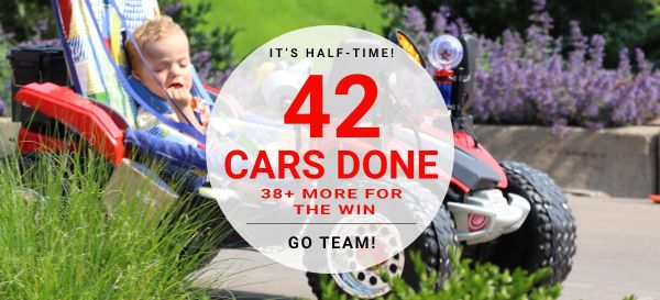 Young boy in Geeks for Kids car with text that says 42 cars done 38+ more for the win